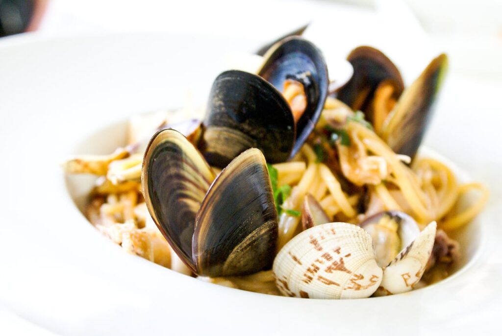 Close-up of Italian seafood pasta with clams and mussels served in Florence.